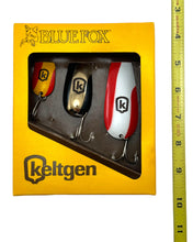 Load image into Gallery viewer, Tape Measure Comparison View of KELTGEN SEED COMPANY BLUE FOX FISHING SPOONS • 1987 Fishing Contest / Promotional 3-Pack. South Dakota Hall of Fame.