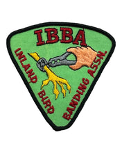 Load image into Gallery viewer, IBBA VOLUNTEER MEMBER PATCH. Hand banding bird claw. Mint Green Background. Red lettering.
