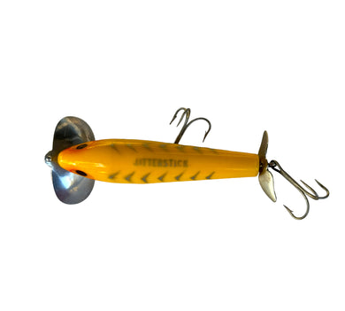 Top View of Vintage Arbogast 5/8 oz JITTERSTICK Topwater Fishing Lure in YELLOW SHORE