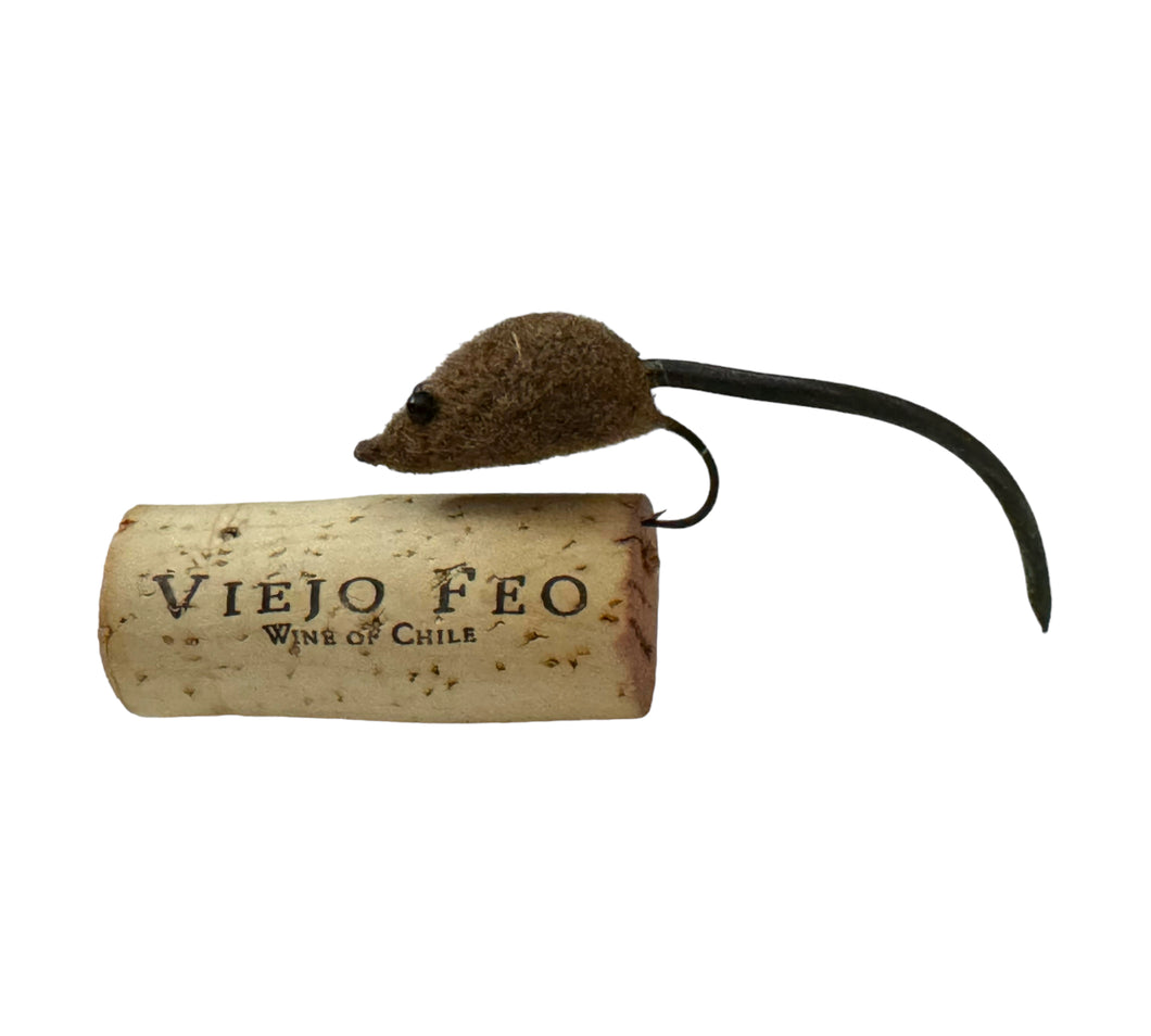Left Facing View of  Vintage FLYROD Size MOUSE Fishing Lure Sitting on a Cork