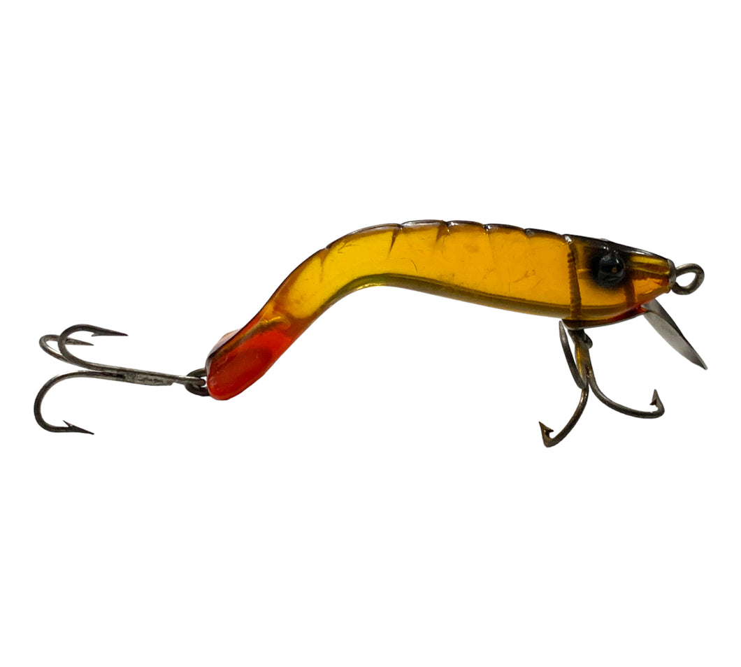 Right Facing View of NICHOLS PLASTIC SHRIMP Vintage Fishing Lure in AMBER w/ RED TAIL
